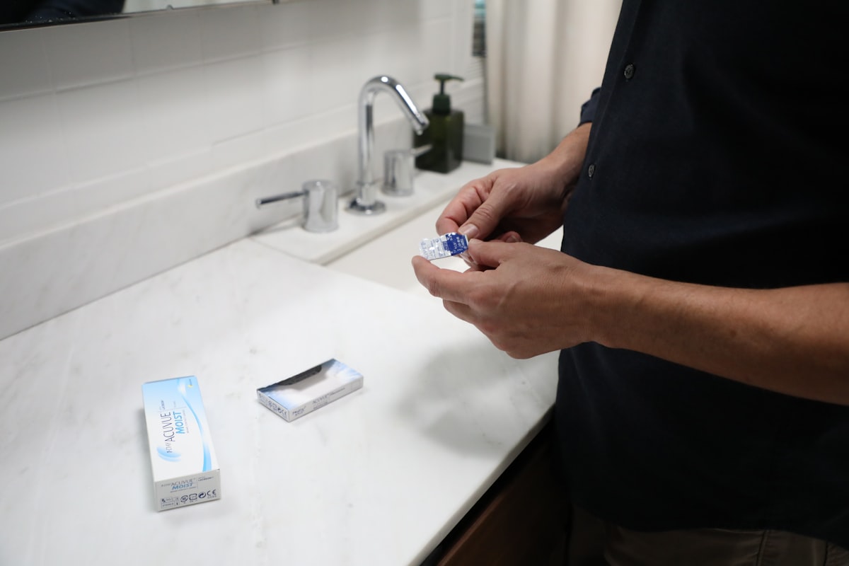 Person holding a contact lens case