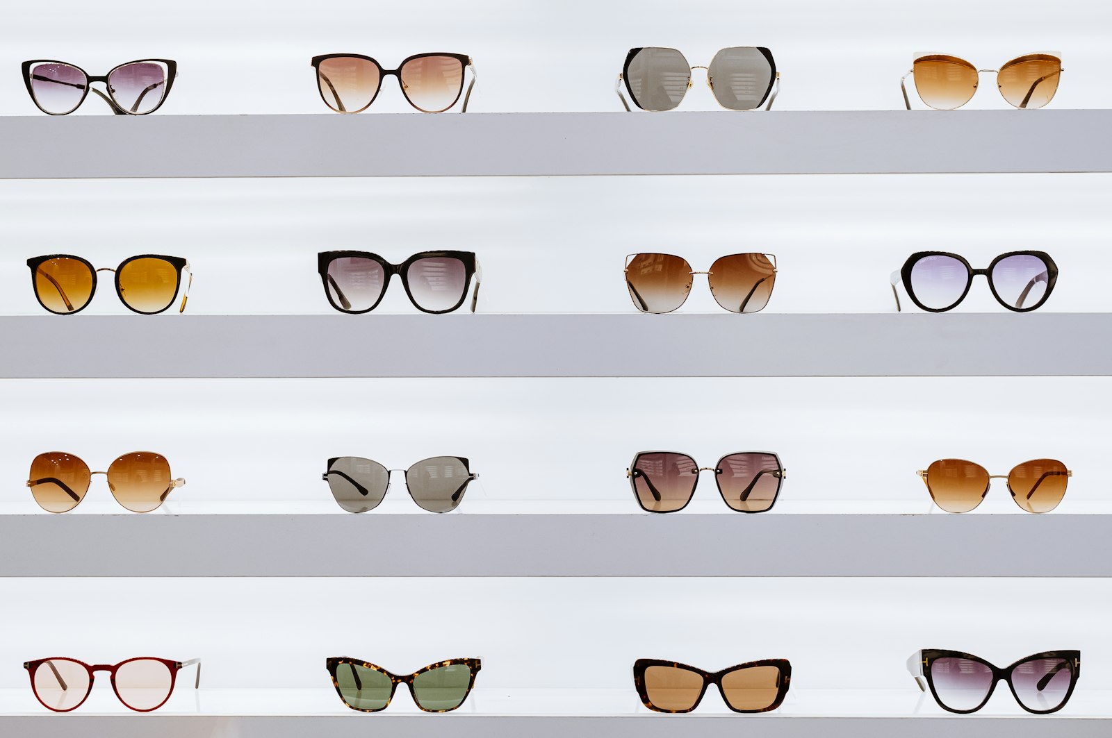 Black designer eyeglass frames displayed on a white surface
